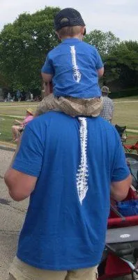 Dr. Raders and his son watching a youth sports game