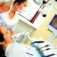 female patient at dentist with intraoral camera in mouth getting Oral Cancer Screening, Melrose dentist