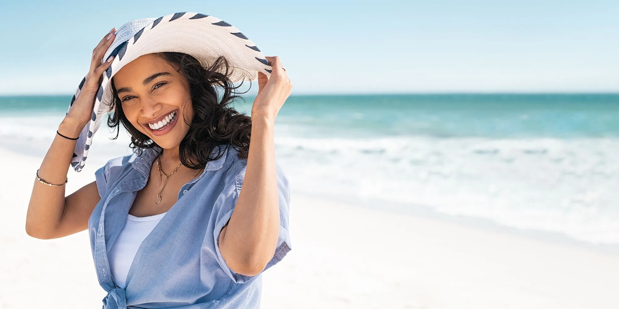 Woman on beach smiling