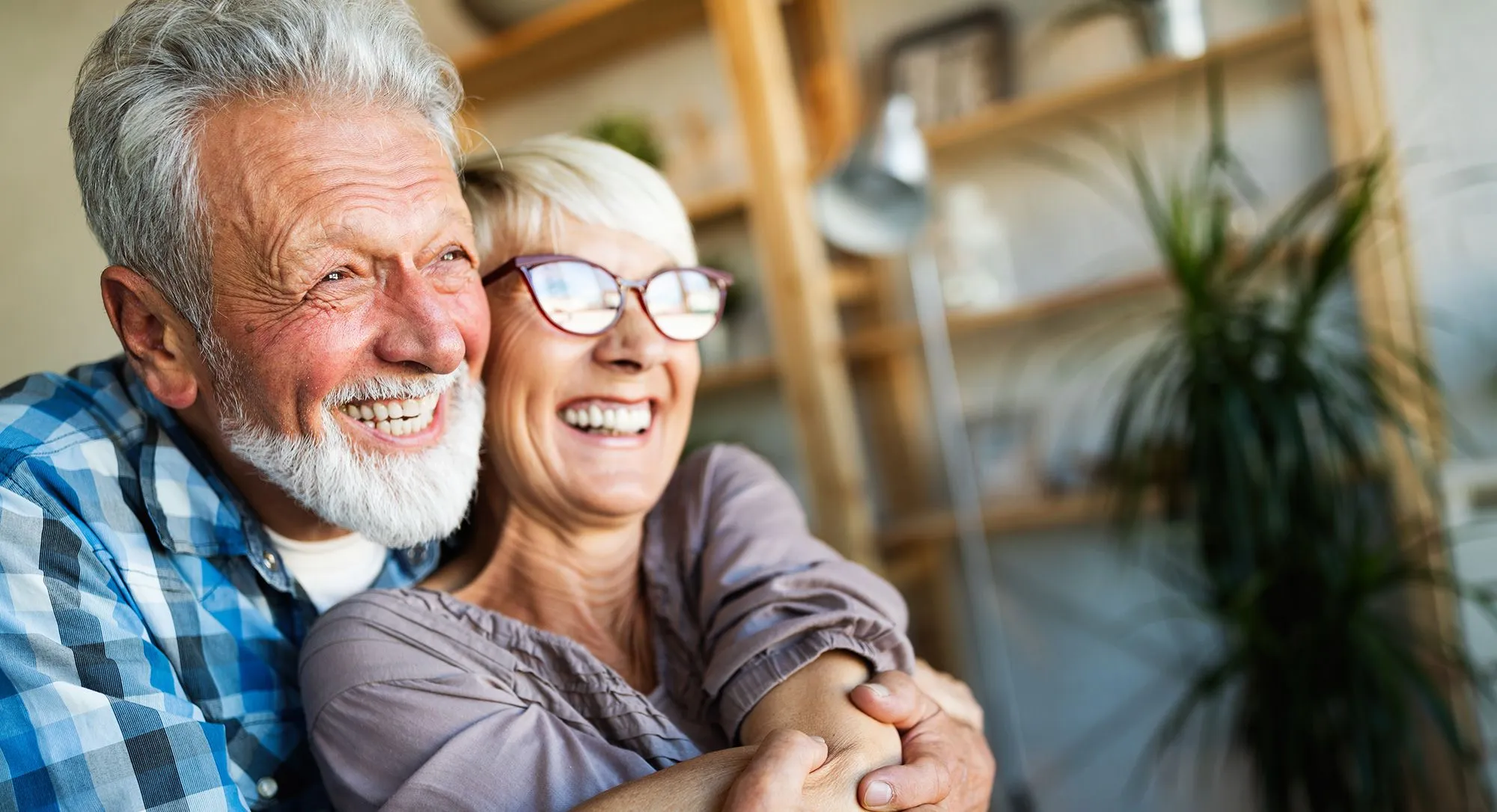 Older couple smiling and hugging