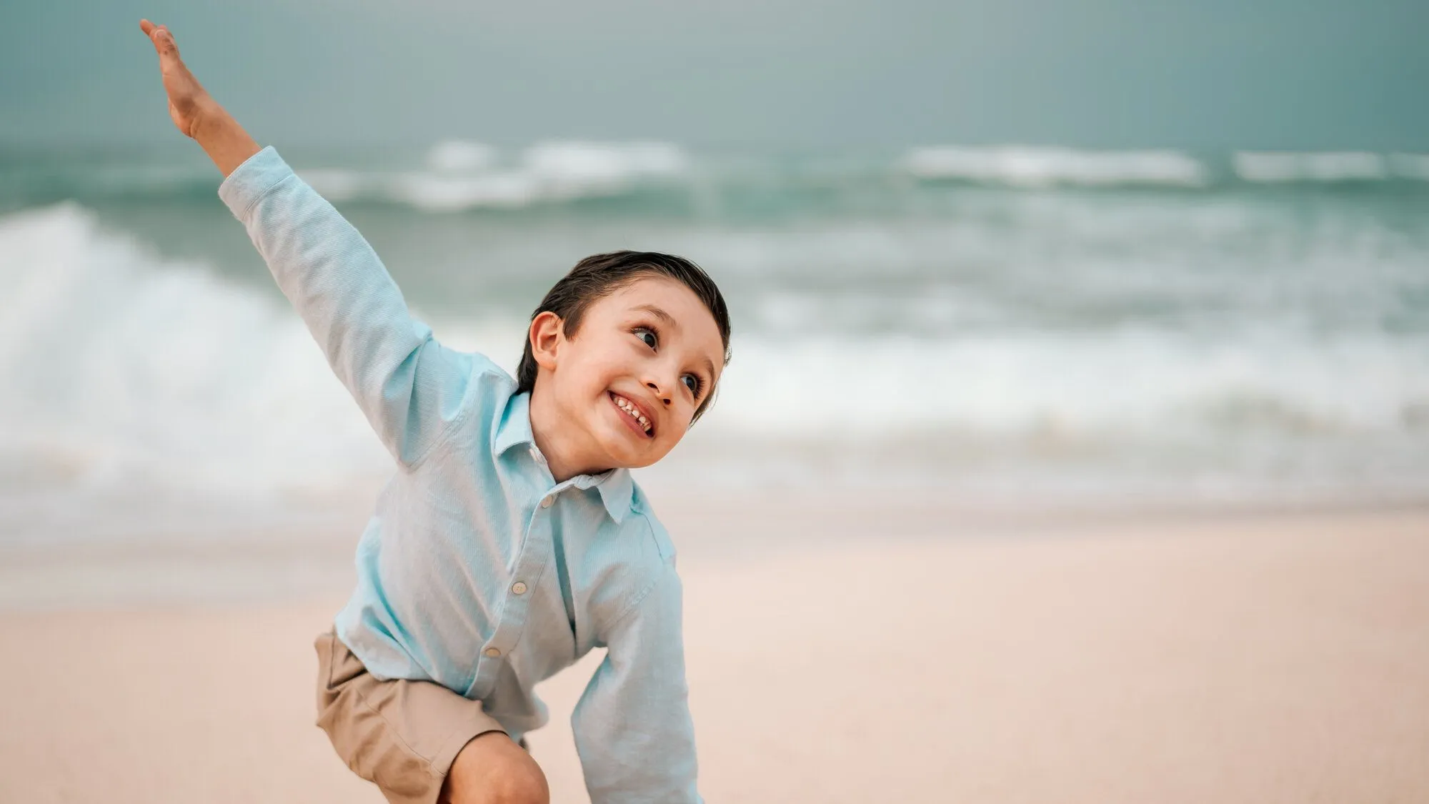 boy holding out arms