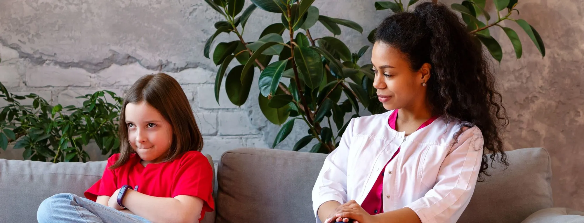 Behavioral Specialist sitting with child