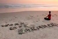 Work life balance spelled in stones on the beach