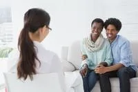 African American couple with female counselor