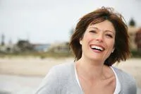 Woman smiling at beach