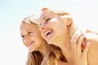 mother and teen daughter smiling