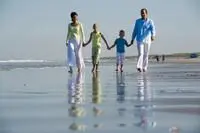 Family walking along the beach