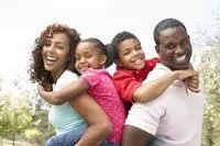 African American family of four smiling