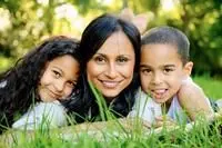 Woman and two children smiling