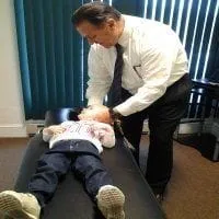 Dr. T treating toddler for ear infections