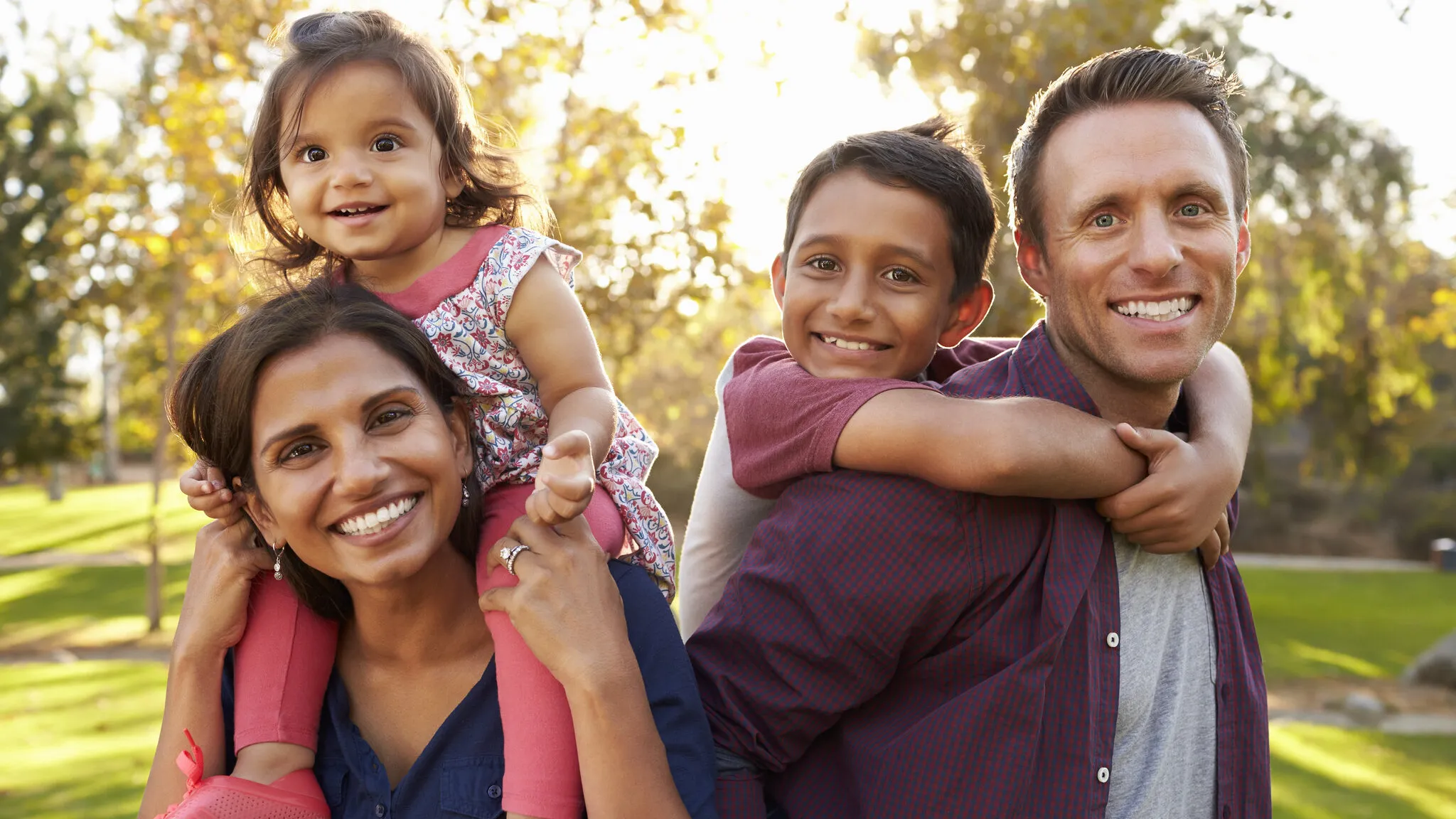 happy family outside big smiles