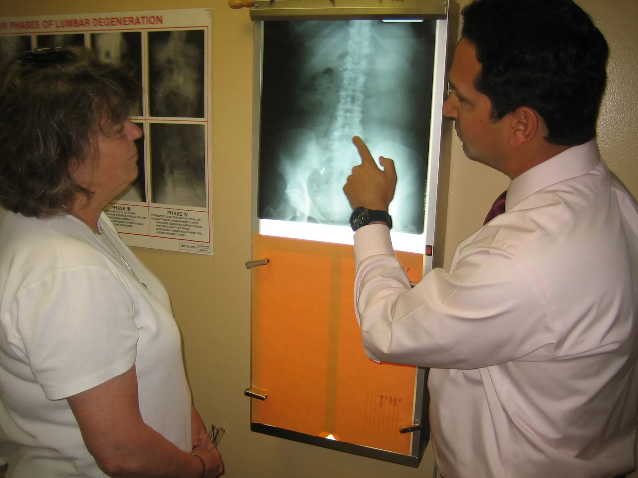 Dr. Mandel and staff at Sharp Chiropractic in Malvern looking at a x-ray