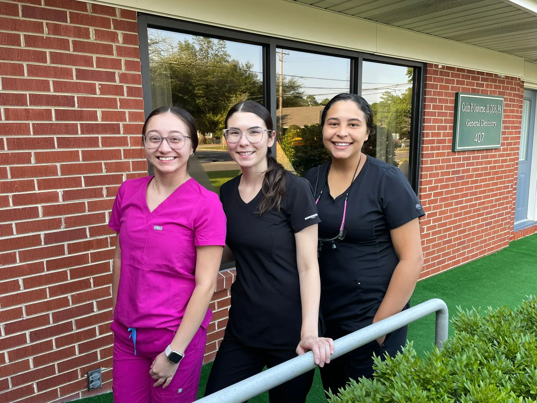 Staff members in front of Dr. Osborne's office