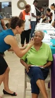 Lucille Anderson gets her eye pressure checked by Dr. Bucci at the   Highlands County NAACP Youth Council Health Fair 2017