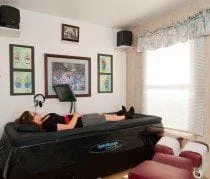 Patient laying down on a water therapy bed