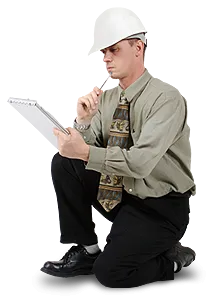 A kneeling man holding a notebook