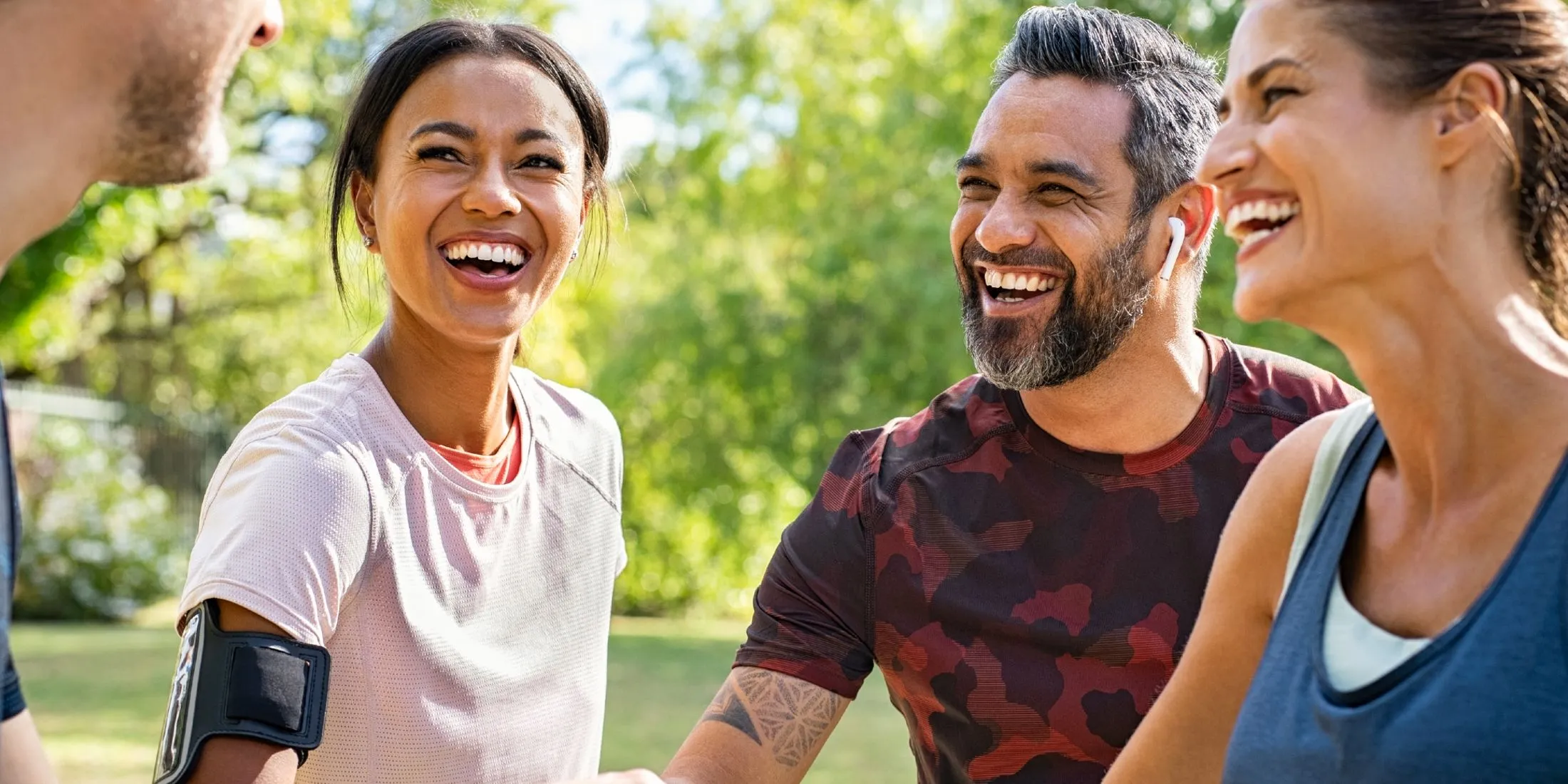 Group of Runners Smiling and Holding Hands