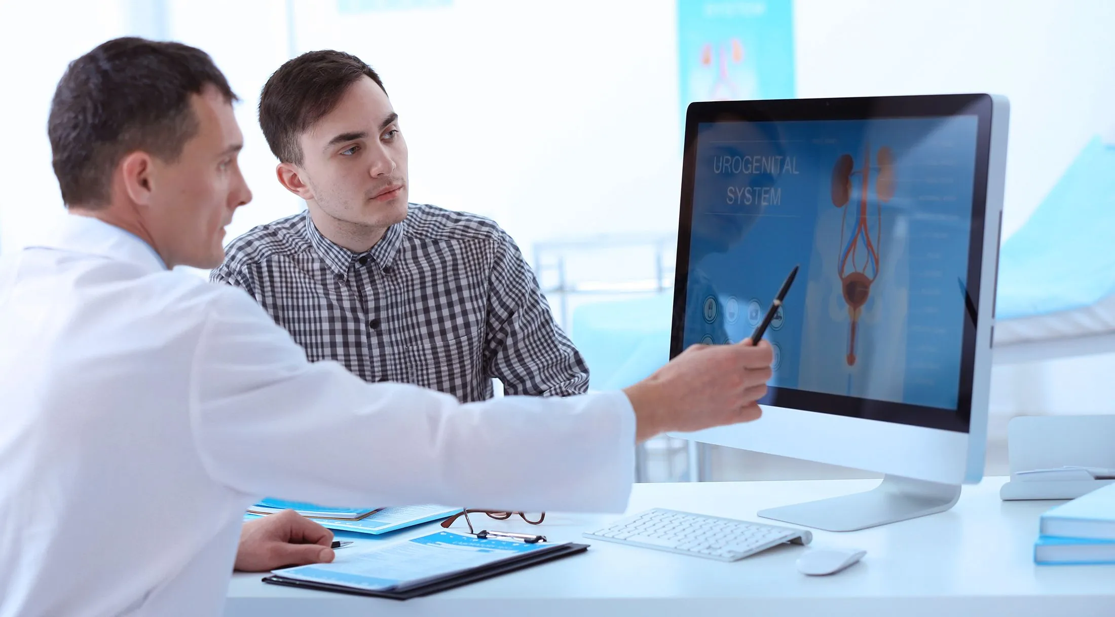 Adult consulting with doctor about UTI problems on computer-generated model