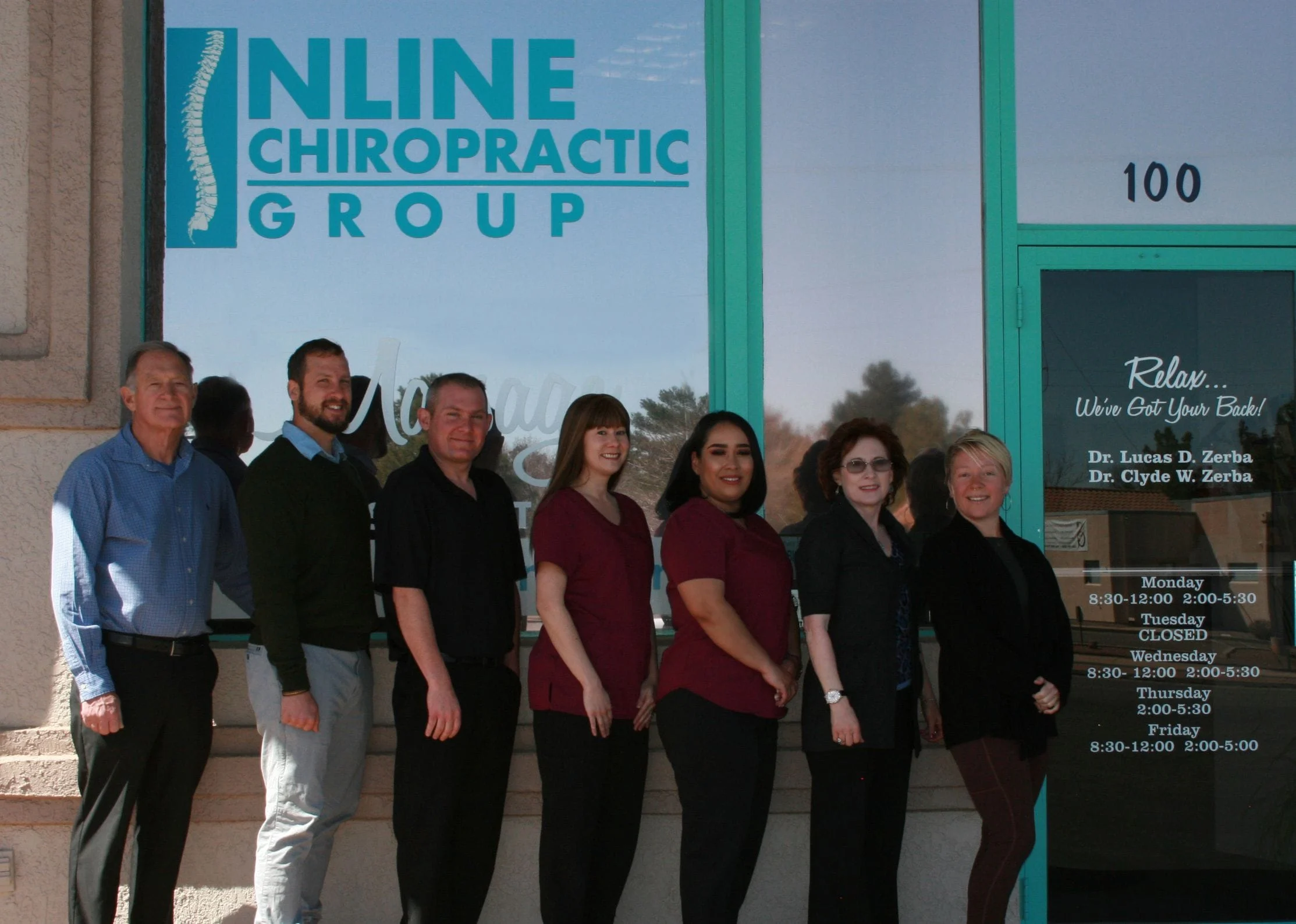 Staff of Inline Chiropractis standing in front of the office entrance