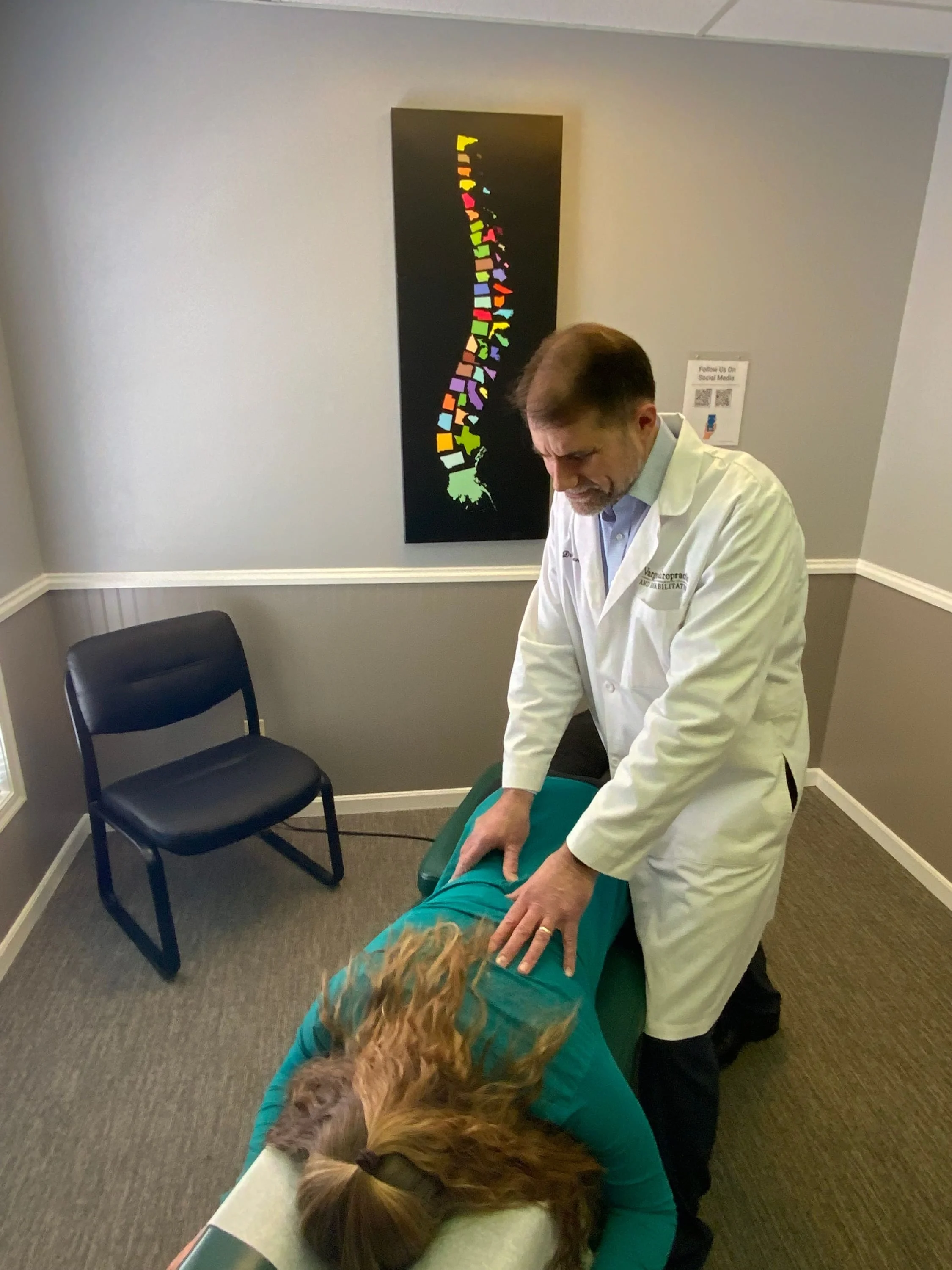 Chiropractor Adjusting a patient
