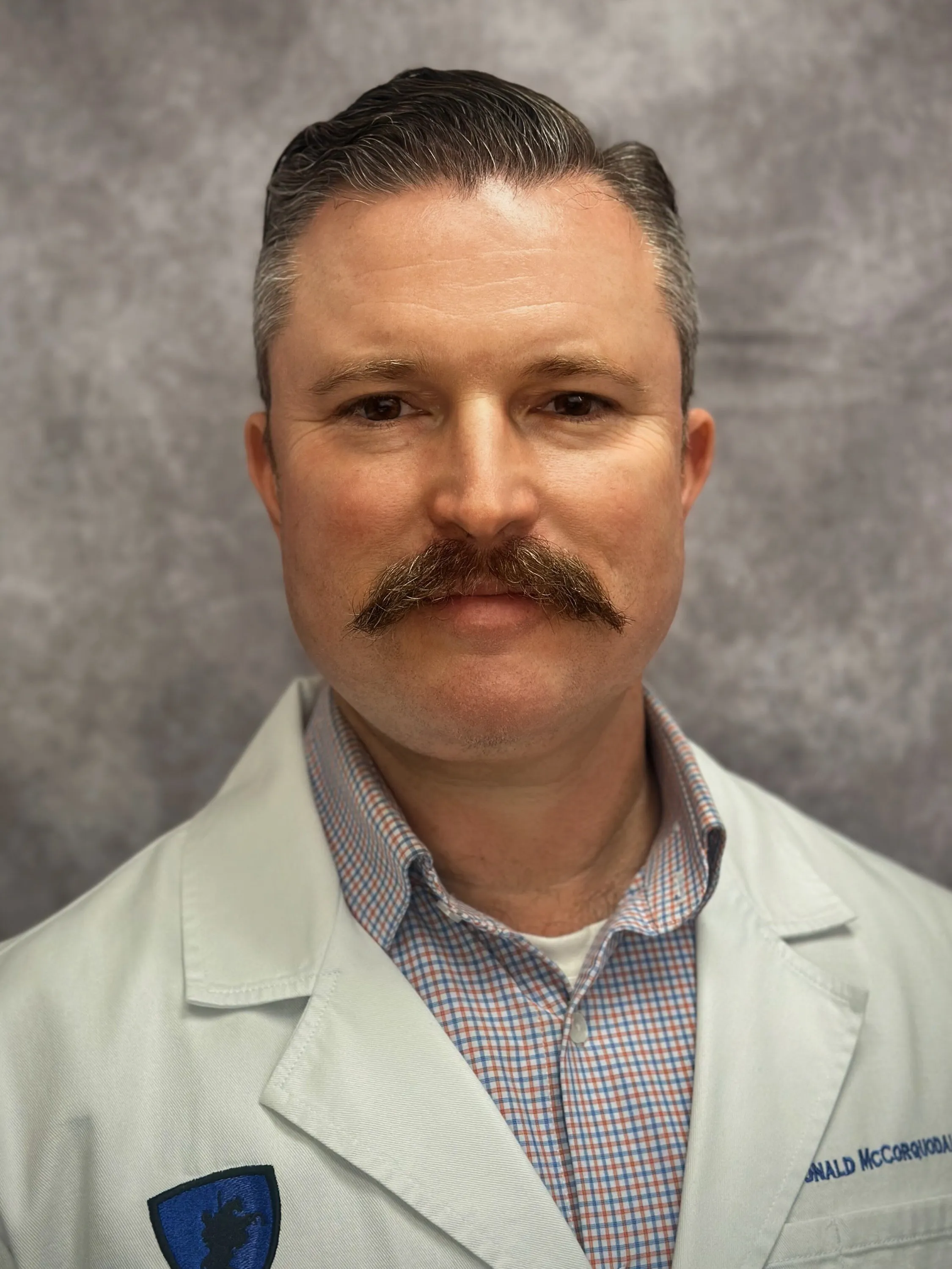 Headshot of Dr. McCorquodale