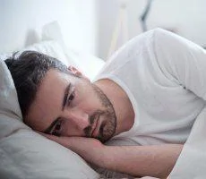 Man who can't sleep and is suffering from insomnia