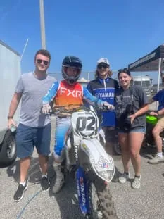 Paulie, Ant, Bri with Gabe before a race