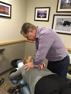Dr. Pokowicz adjusting a patient