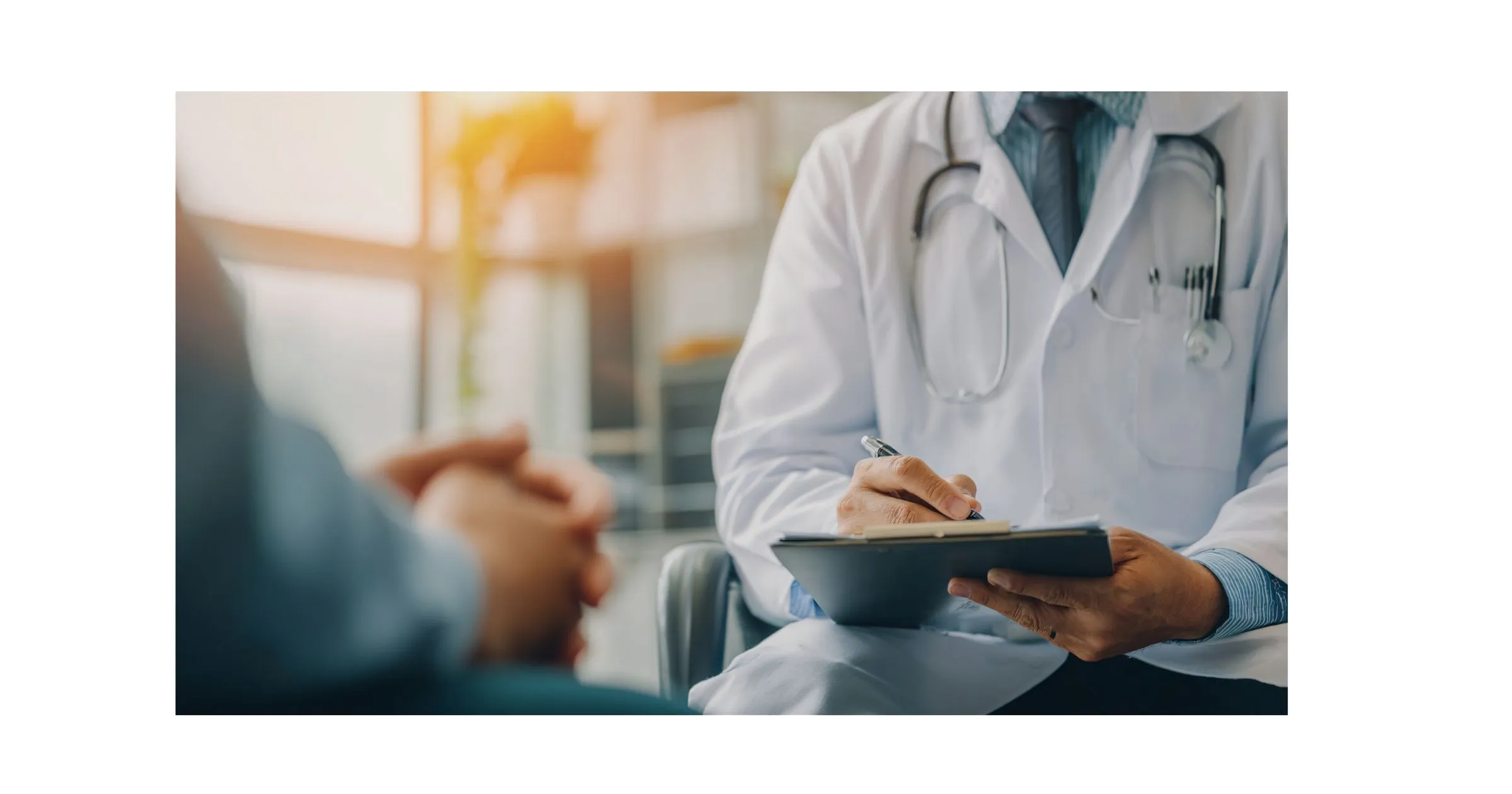 Chiropractor helping Tulsa auto accident patient during consultation