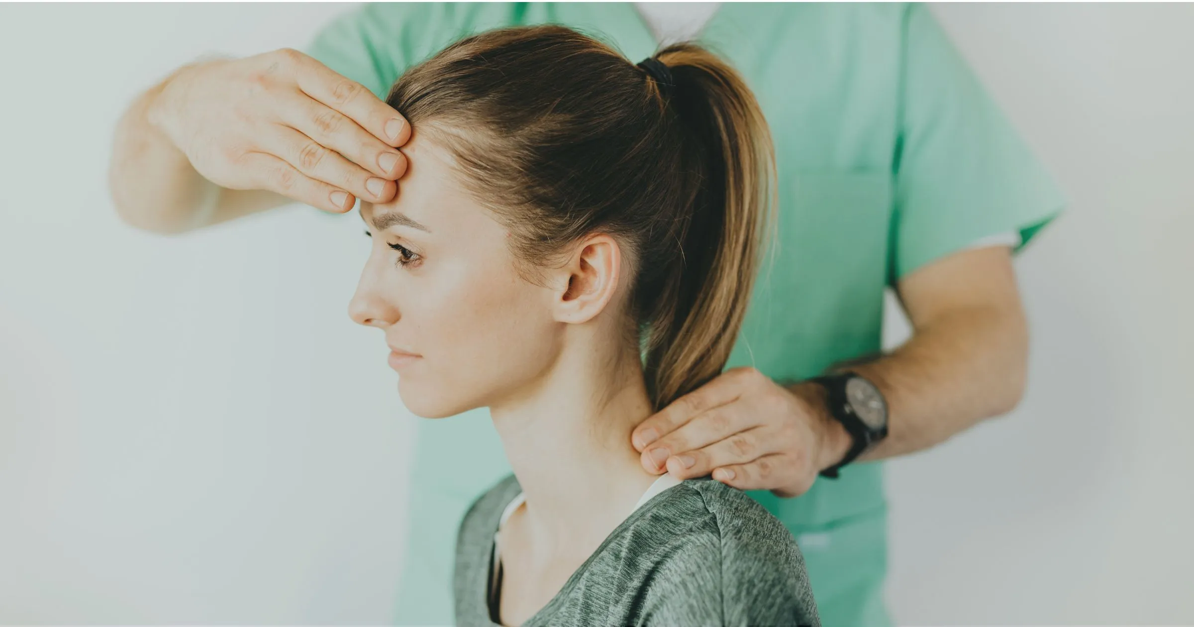Patient being diagnosed with whiplash during exam at Cole Chiropractic Clinic in Tulsa