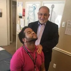 Dr. Pizza with chiropractic patient