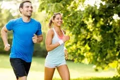 An image of a healthy couple running together.