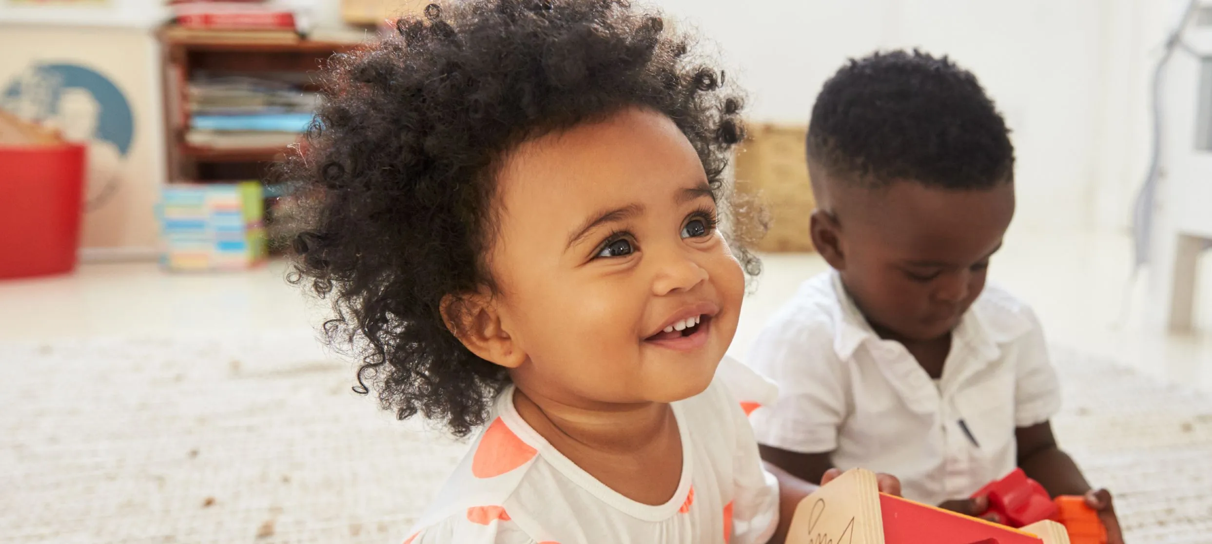 Two children playing with toys