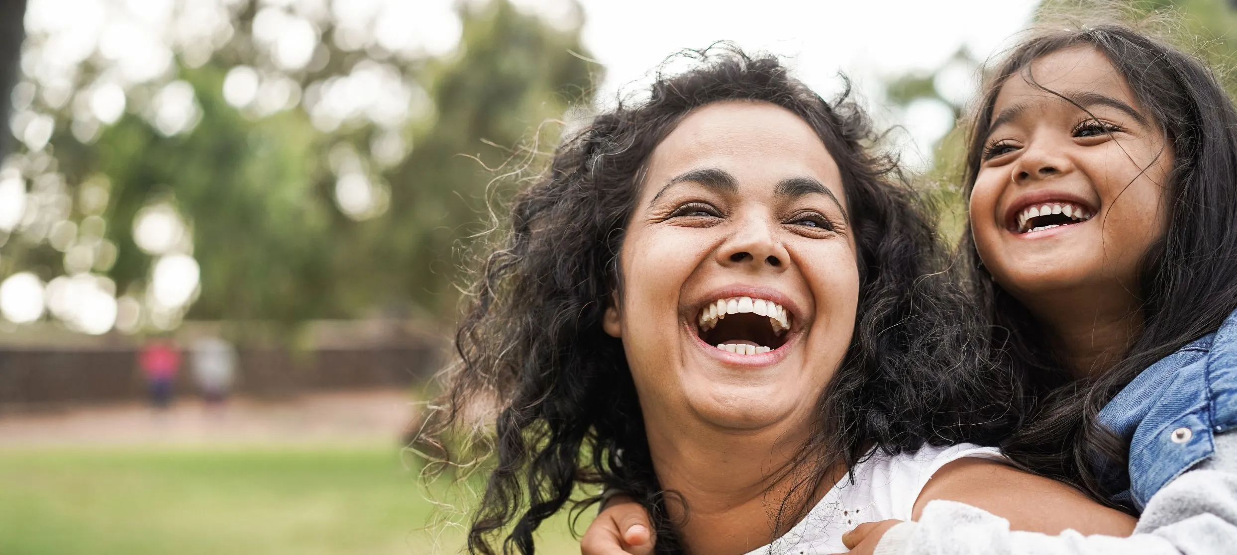 Mother and daughter smiling