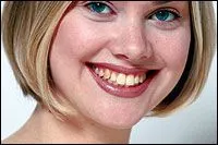 blond girl smiling with yellowed teeth, before teeth whitening Huntsville, AL
