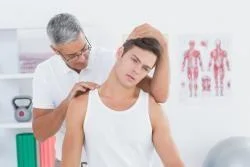 male patient getting a chiropractic adjustment from his chiropractor