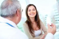 woman smiling with male doctor