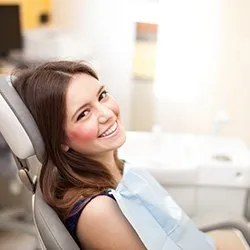 Smiling woman in dental chair