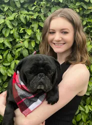 Megan with her black pug Gup