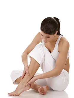 women examining foot