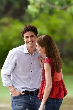 man outdoors smiling looking forward, woman standing to his right, orthodontist Cumberland Park, SA 