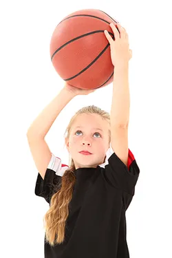 girl shooting a basketball