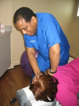Dr. Carlisle adjusting patient