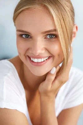 blond woman smiling nice white straight teeth, Invisalign Royal Palm Beach, FL dentist