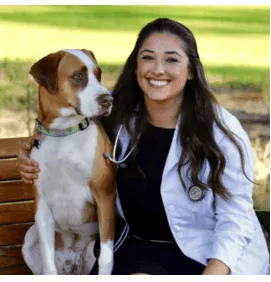 Female Veterinarian with Brown and White Dog