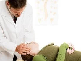 Doctor Adjusting a Patient