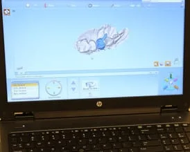 photo of a crown being designed digitally on a laptop