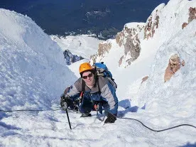 Dr. Roger on top of mountain