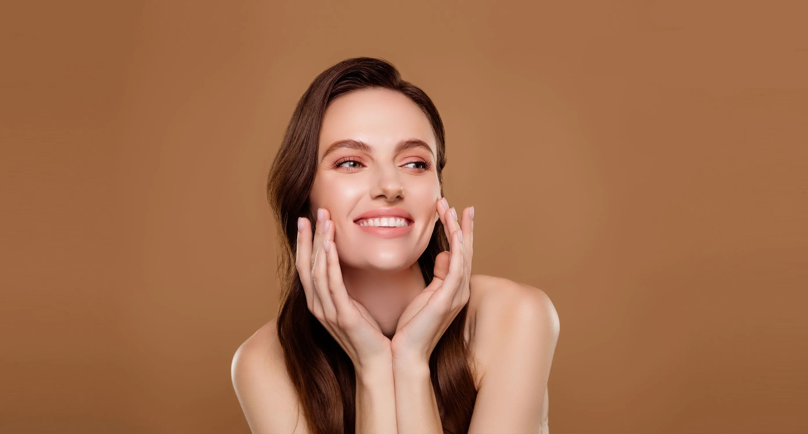 smiling woman touching her face