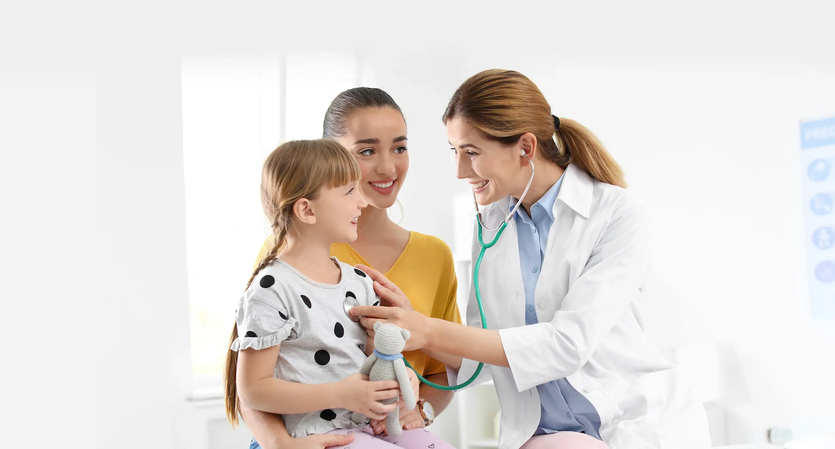 doctor with girl and mom